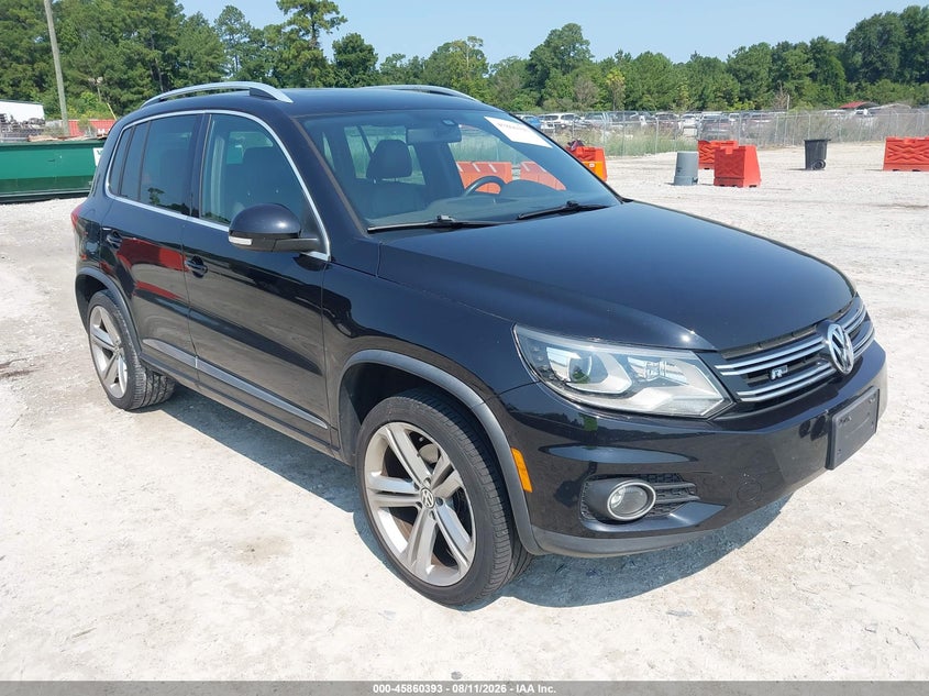 2014 Volkswagen Tiguan VIN WVGAV3AXXEW012949 IAAI salvage auction — NORMAL WEAR, Salvage Title, sold $2,450 on 2026-08-18 (photo 1)