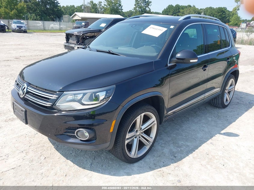 2014 Volkswagen Tiguan VIN WVGAV3AXXEW012949 IAAI salvage auction — NORMAL WEAR, Salvage Title, sold $2,450 on 2026-08-18 (photo 2)
