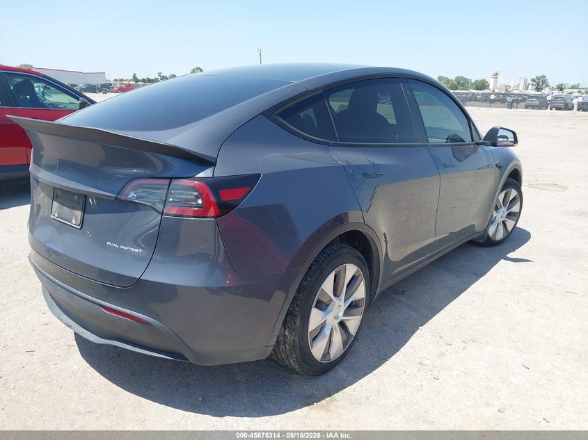 2023 Tesla Model y VIN 7SAYGDEE3PA040904 IAAI salvage auction — REAR END, Salvage (Texas), sold $12,700 on 2026-08-28 (photo 4)