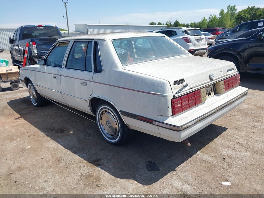1985 Plymouth Caravelle VIN 1P3BJ46D3FC213779 IAAI salvage auction — NORMAL WEAR, Clear (Oklahoma), sold $150 on 2026-09-02 (photo 3)