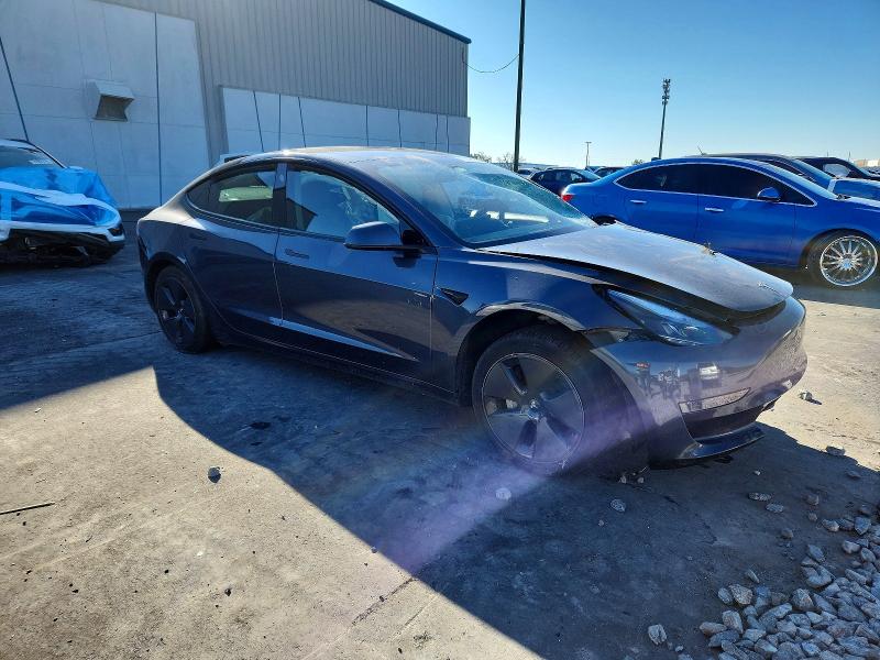 2023 Tesla Model 3 VIN 5YJ3E1EA6PF448020 COPART salvage auction — SIDE, Fl - Cert Of Title Slvg Rebuildable, sold $3,200 on 2026-07-06 (photo 4)