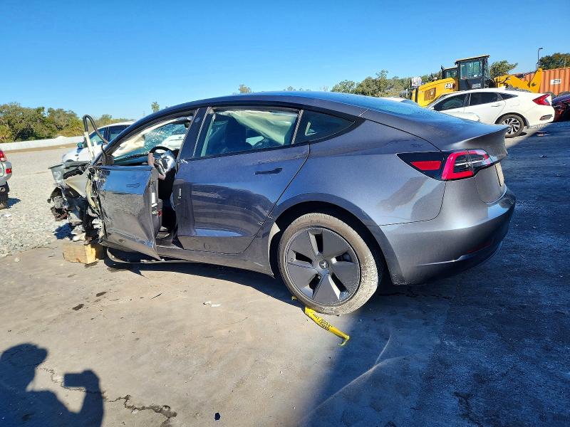 2023 Tesla Model 3 VIN 5YJ3E1EA6PF448020 COPART salvage auction — SIDE, Fl - Cert Of Title Slvg Rebuildable, sold $3,200 on 2026-07-06 (photo 2)