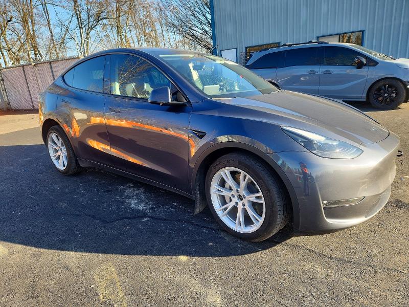 2023 Tesla Model y VIN 7SAYGAEE7PF771059 COPART salvage auction — FRONT END, Or - Salvage Title Certificate, sold $8,200 on 2026-07-22 (photo 4)