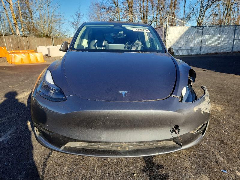 2023 Tesla Model y VIN 7SAYGAEE7PF771059 COPART salvage auction — FRONT END, Or - Salvage Title Certificate, sold $8,200 on 2026-07-22 (photo 5)