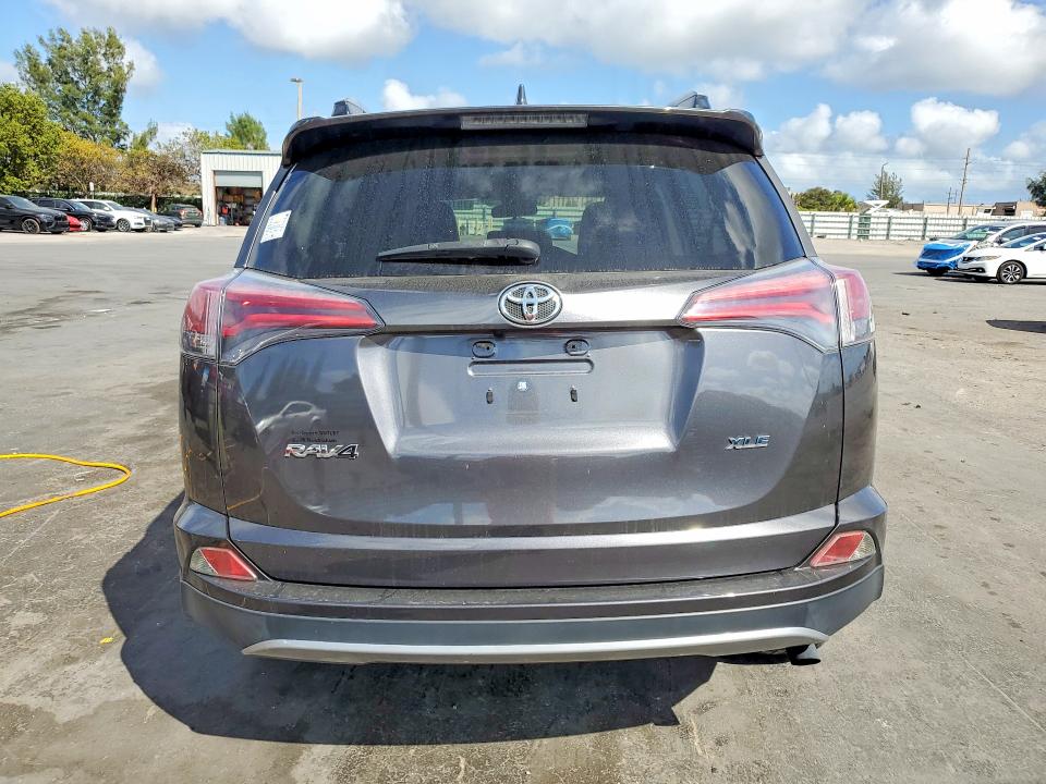2018 Toyota Rav 4 VIN JTMWFREV8JJ750873 COPART salvage auction — SIDE, Salvage Title, sold $5,100 on 2026-07-15 (photo 6)