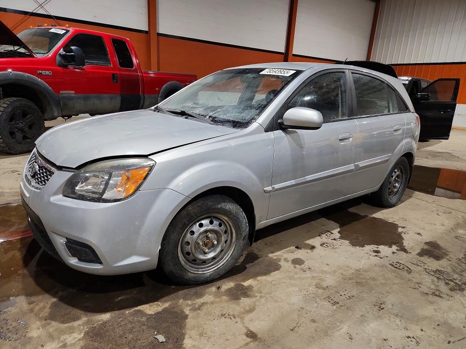 2011 Kia Rio VIN KNADH5B39B6756700 COPART salvage auction — VANDALISM, AB - BOS - SALVAGE, sold $450 on 2026-07-14 (photo 1)