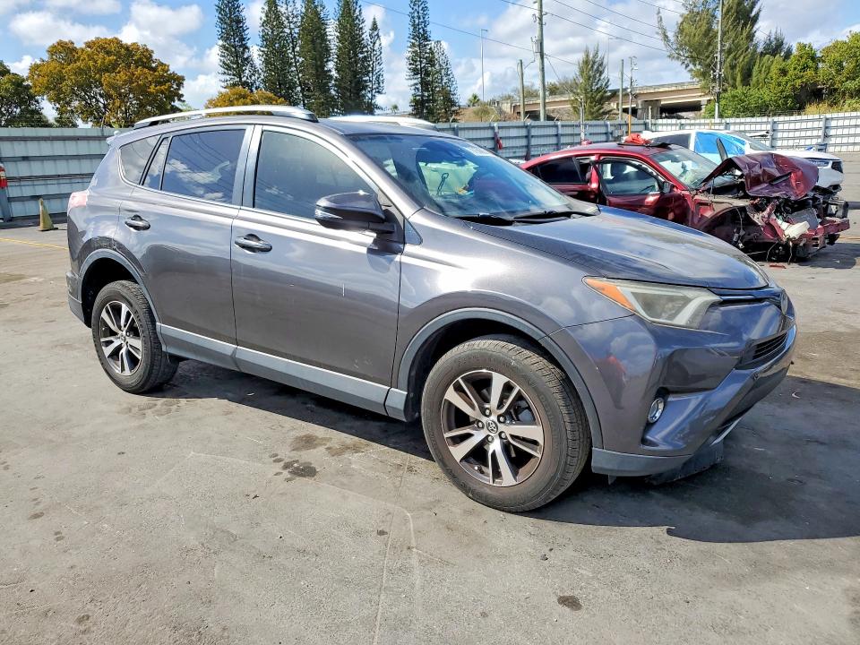 2018 Toyota Rav 4 VIN JTMWFREV8JJ750873 COPART salvage auction — SIDE, Salvage Title, sold $5,100 on 2026-07-15 (photo 4)