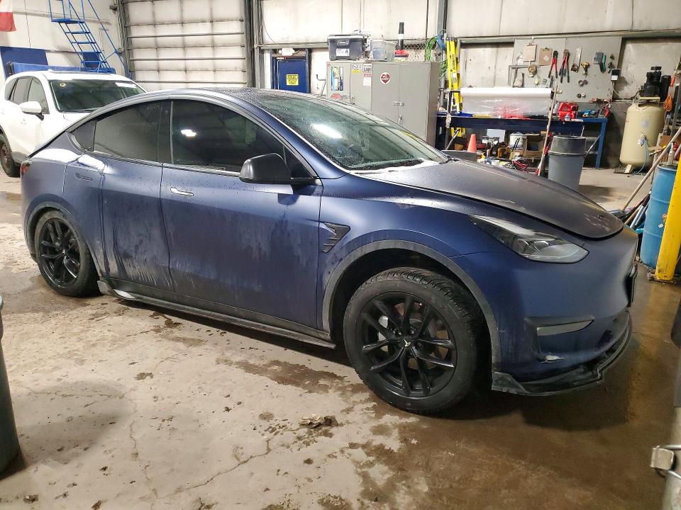 2023 Tesla Model y VIN 7SAYGDEE7PF648573 COPART salvage auction — REAR END, On - Permit No Brand - Unfit, sold $16,650 on 2026-07-02 (photo 4)