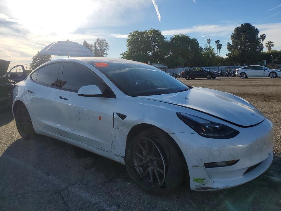 2023 Tesla Model 3 VIN 5YJ3E1EA0PF400870 COPART salvage auction — SIDE, CA - SALVAGE CERTIFICATE, sold $5,800 on 2026-07-31 (photo 4)