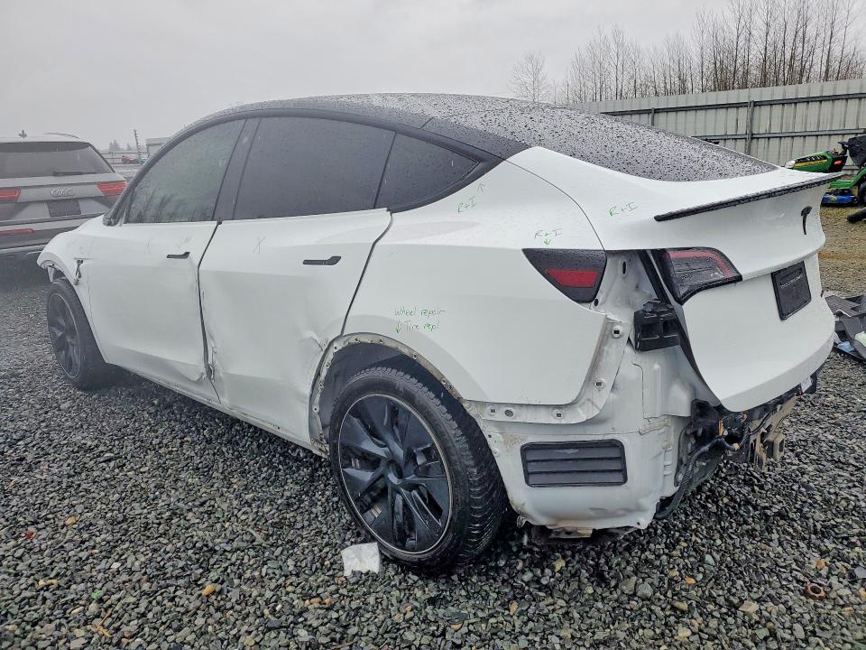 2023 Tesla Model y VIN 7SAYGDEE4PF628247 COPART salvage auction — SIDE, Salvage Title, sold $10,700 on 2026-07-13 (photo 2)