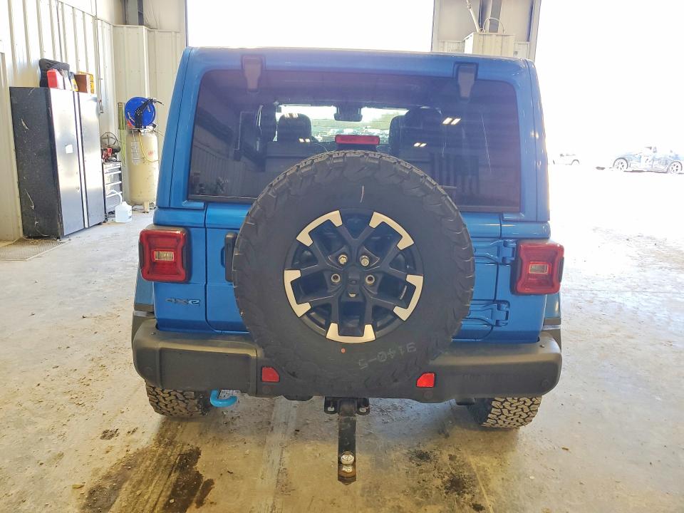 2024 Jeep Wrangler / VIN 1C4RJXR6XRW186788 COPART salvage auction — MINOR DENT/SCRATCHES, Mo - Certificate Of Title, sold $25,500 on 2026-07-09 (photo 6)