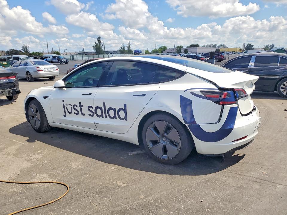 2023 Tesla Model 3 VIN 5YJ3E1EA9PF554834 COPART salvage auction — REAR END, Fl - Cert Of Title Slvg Rebuildable, sold $3,100 on 2026-07-13 (photo 2)