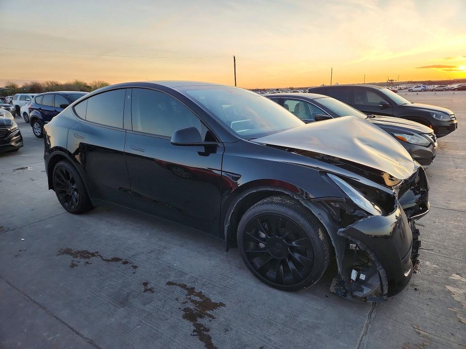 2023 Tesla Model y VIN 7SAYGDEE9PA094059 COPART salvage auction — FRONT END, TX - SALVAGE VEHICLE TITLE, sold $9,500 on 2026-08-03 (photo 4)