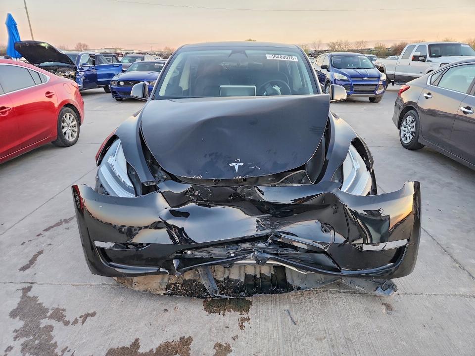 2023 Tesla Model y VIN 7SAYGDEE9PA094059 COPART salvage auction — FRONT END, TX - SALVAGE VEHICLE TITLE, sold $9,500 on 2026-08-03 (photo 5)
