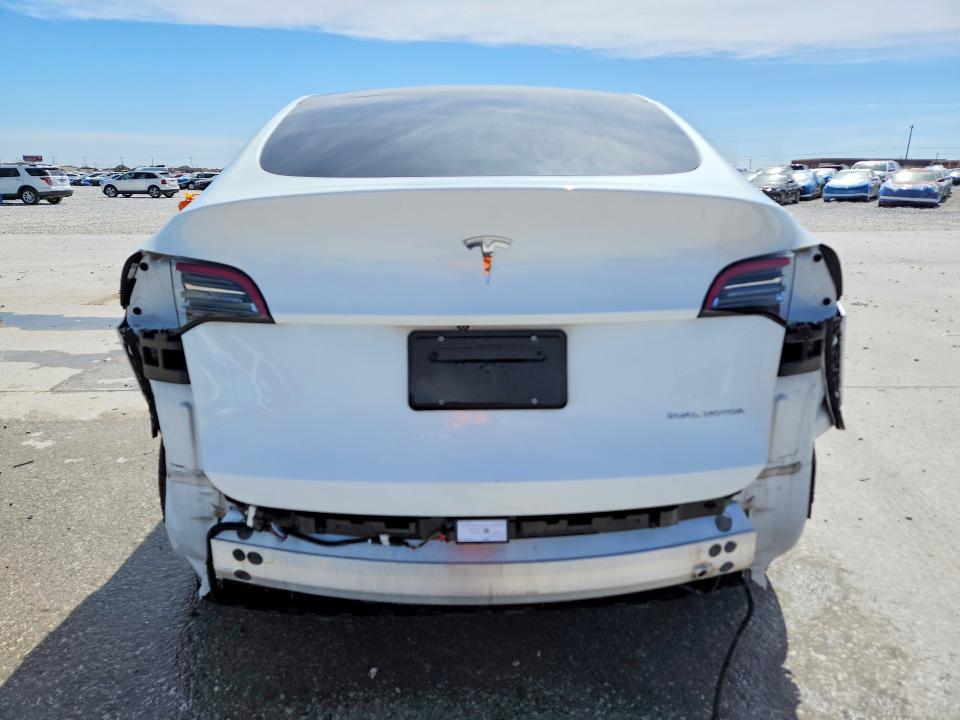 2021 Tesla Model Y VIN 5YJYGDEE1MF306898 COPART salvage auction — Rear End, TX - CERTIFICATE OF TITLE, sold $10,000 on 2026-05-19 (photo 6)