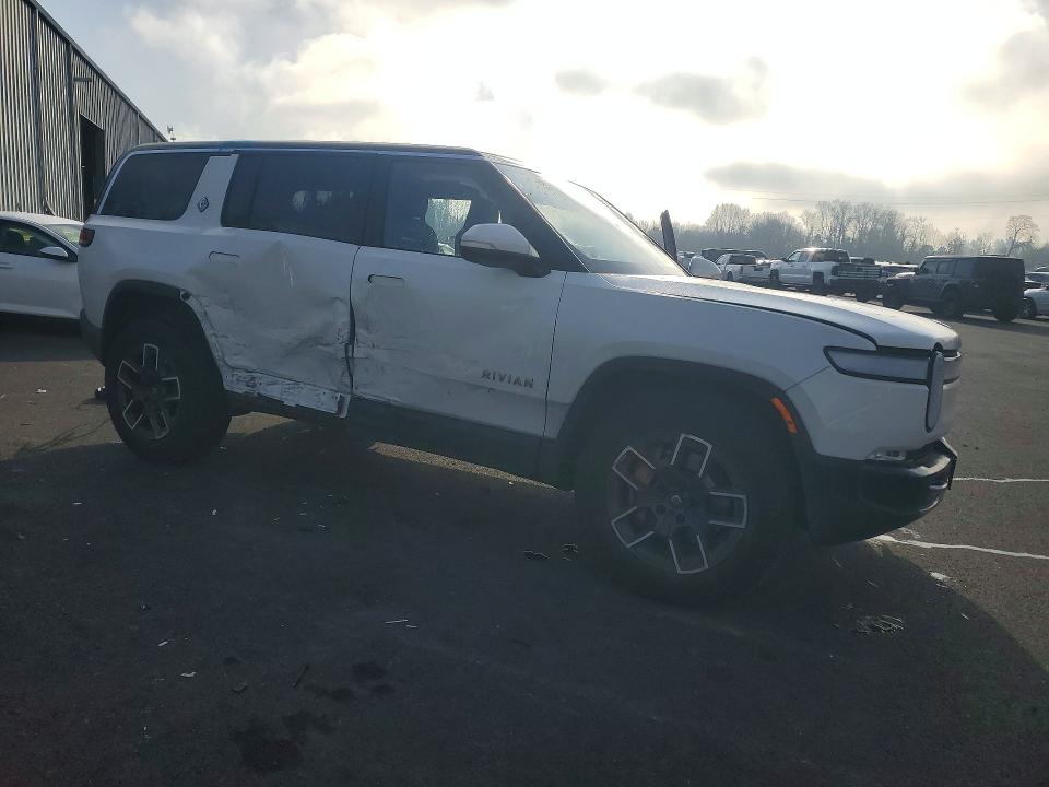 2023 Rivian R1s VIN 7PDSGABA4PN017518 COPART salvage auction — SIDE, Or - Salvage Title Certificate, sold $23,200 on 2026-07-13 (photo 4)