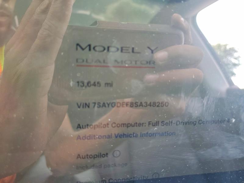 2025 Tesla Model y VIN 7SAYGDEF8SA348250 COPART salvage auction — FRONT END, FL, sold $13,500 on 2026-07-14 (photo 9)
