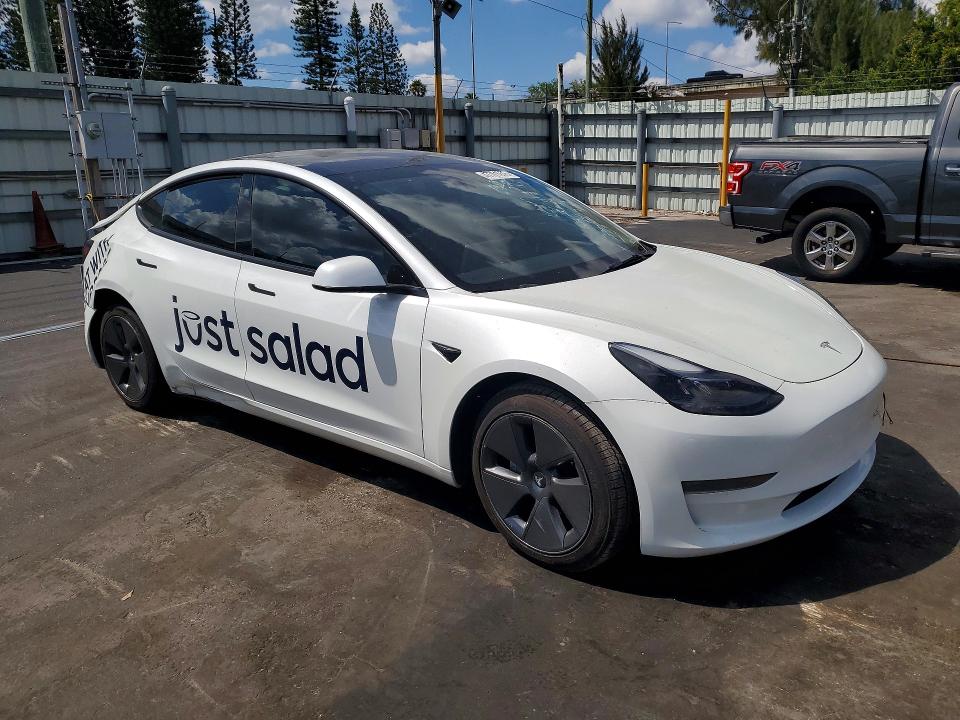 2023 Tesla Model 3 VIN 5YJ3E1EA9PF554834 COPART salvage auction — REAR END, Fl - Cert Of Title Slvg Rebuildable, sold $3,100 on 2026-07-13 (photo 4)