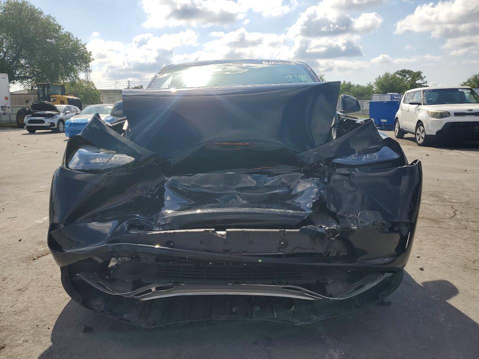 2025 Tesla Model y VIN 7SAYGDEF8SA348250 COPART salvage auction — FRONT END, FL, sold $13,500 on 2026-07-14 (photo 5)