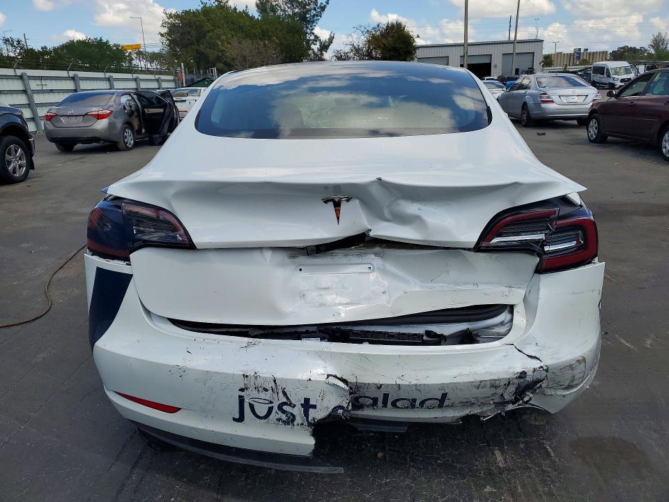 2023 Tesla Model 3 VIN 5YJ3E1EA9PF554834 COPART salvage auction — REAR END, Fl - Cert Of Title Slvg Rebuildable, sold $3,100 on 2026-07-13 (photo 6)