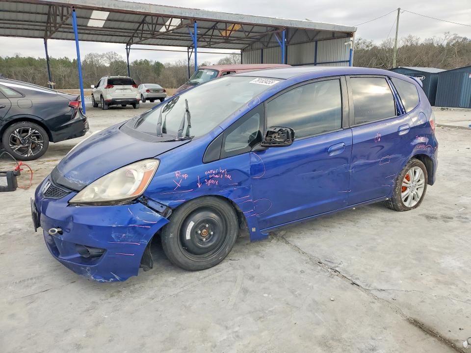 2009 Honda Fit VIN JHMGE886X9S056423 COPART salvage auction — SIDE, GA - CERT OF TITLE-SALVAGE, sold $575 on 2026-07-09 (photo 1)