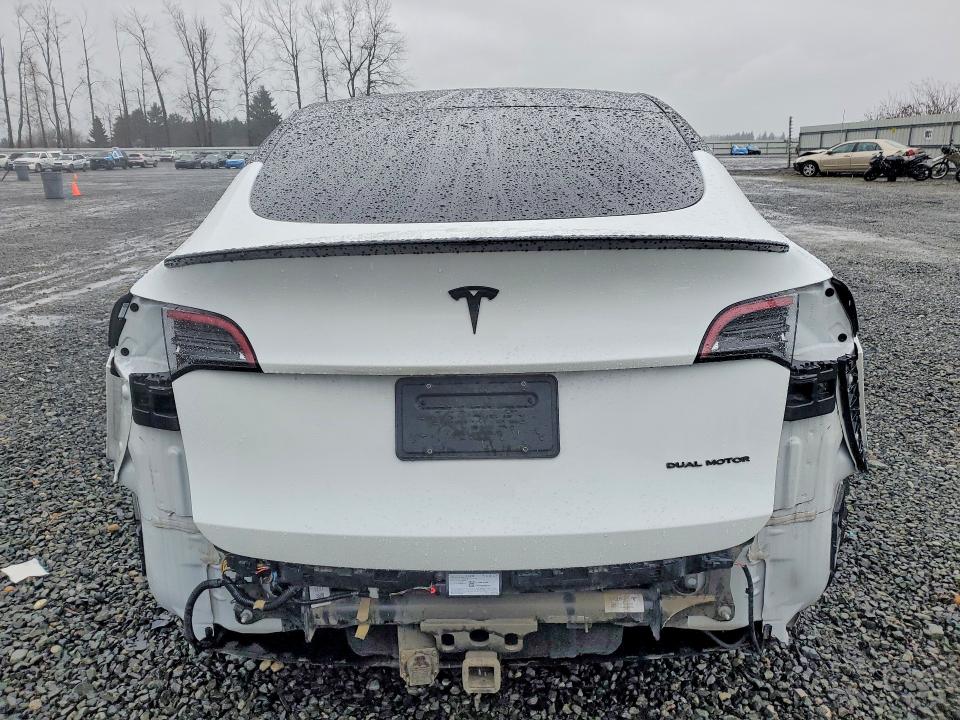 2023 Tesla Model y VIN 7SAYGDEE4PF628247 COPART salvage auction — SIDE, Salvage Title, sold $10,700 on 2026-07-13 (photo 6)
