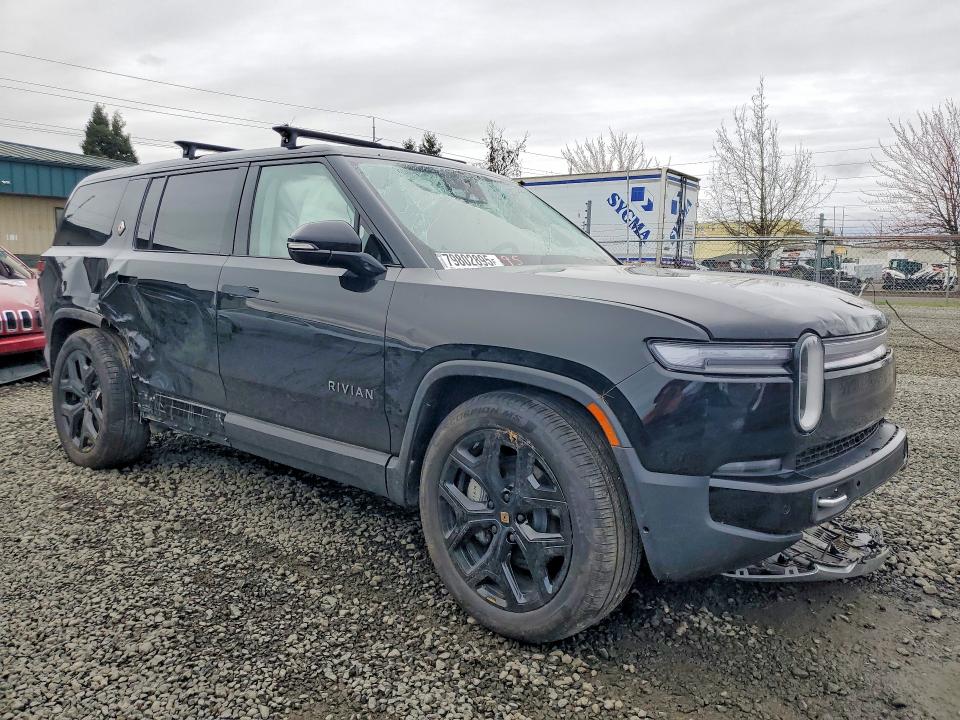 2025 Rivian VIN 7PDSGBBA5SN066855 COPART salvage auction — ROLLOVER, OR - LIEN PAPERS SALVAGE, sold $13,200 on 2026-08-25 (photo 4)