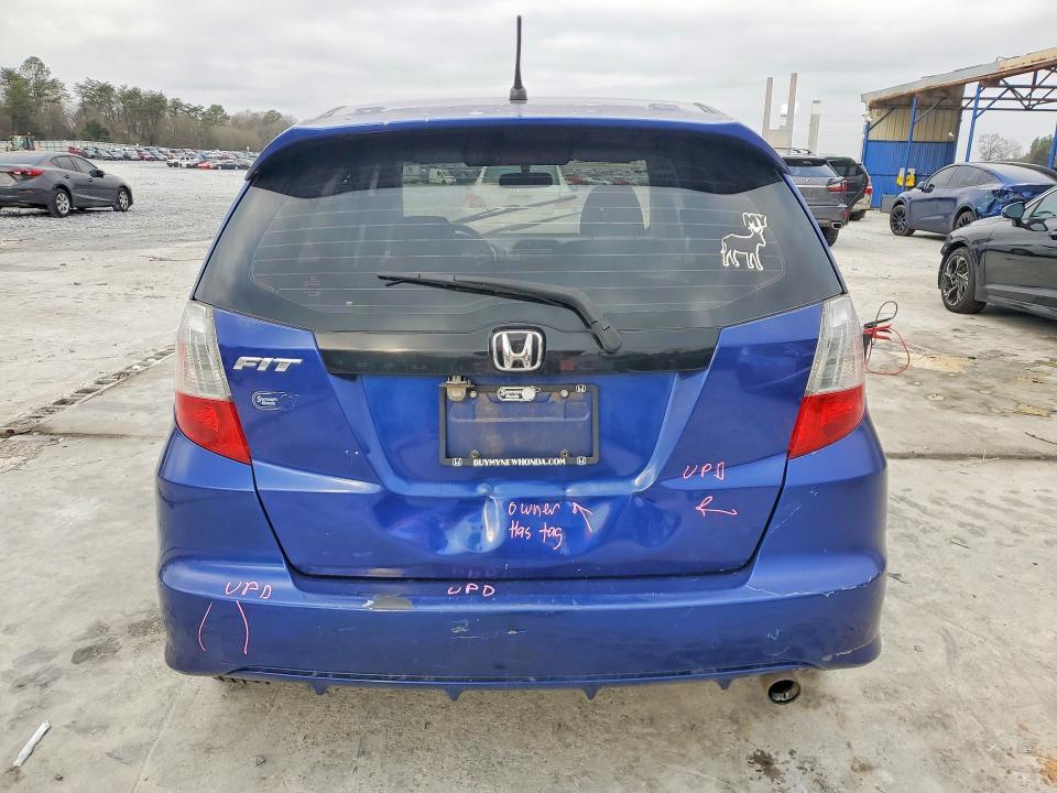 2009 Honda Fit VIN JHMGE886X9S056423 COPART salvage auction — SIDE, GA - CERT OF TITLE-SALVAGE, sold $575 on 2026-07-09 (photo 6)