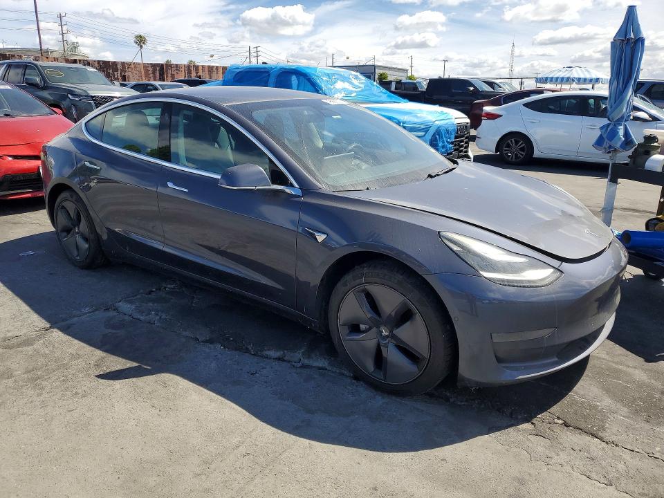 2020 Tesla Model 3 VIN 5YJ3E1EA8LF705091 COPART salvage auction — NORMAL WEAR, Salvage Title, sold $4,550 on 2026-10-23 (photo 4)