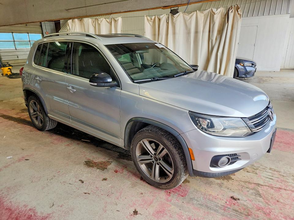 2017 Volkswagen Tiguan VIN WVGTV7AX7HK019420 COPART salvage auction — SIDE, Salvage Title, sold $2,150 on 2026-08-10 (photo 4)