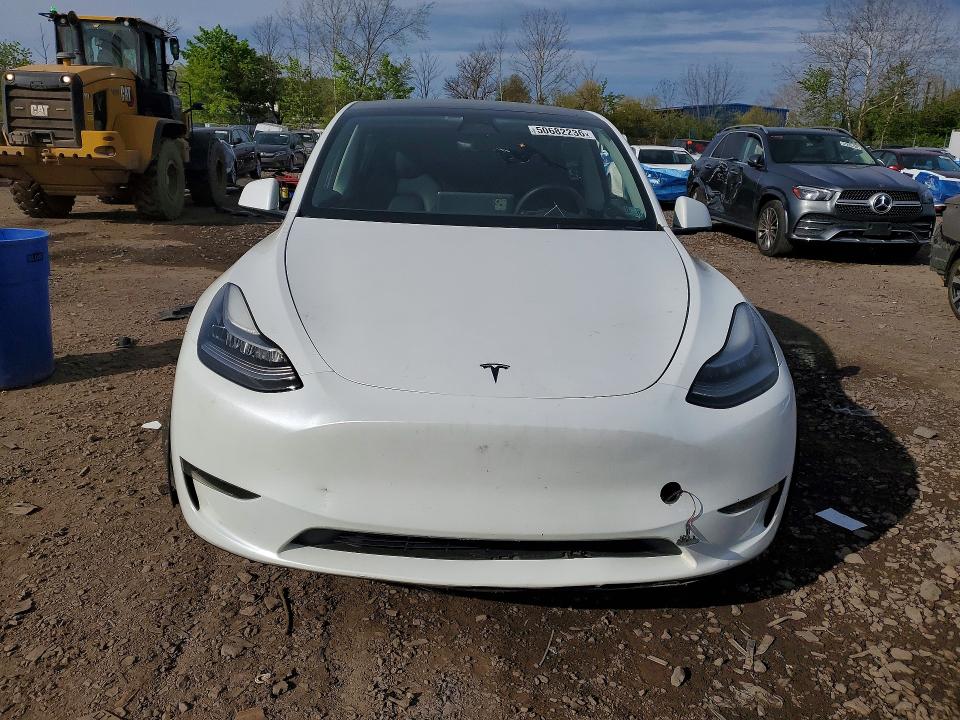 2023 Tesla Model y VIN 7SAYGDEE9PA025095 COPART salvage auction — SIDE, Salvage Title, sold $9,100 on 2026-07-15 (photo 5)