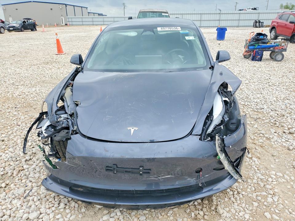 2023 Tesla Model 3 VIN 5YJ3E1EA4PF695178 COPART salvage auction — SIDE, TX - SALVAGE VEHICLE TITLE, sold $3,450 on 2026-07-02 (photo 5)