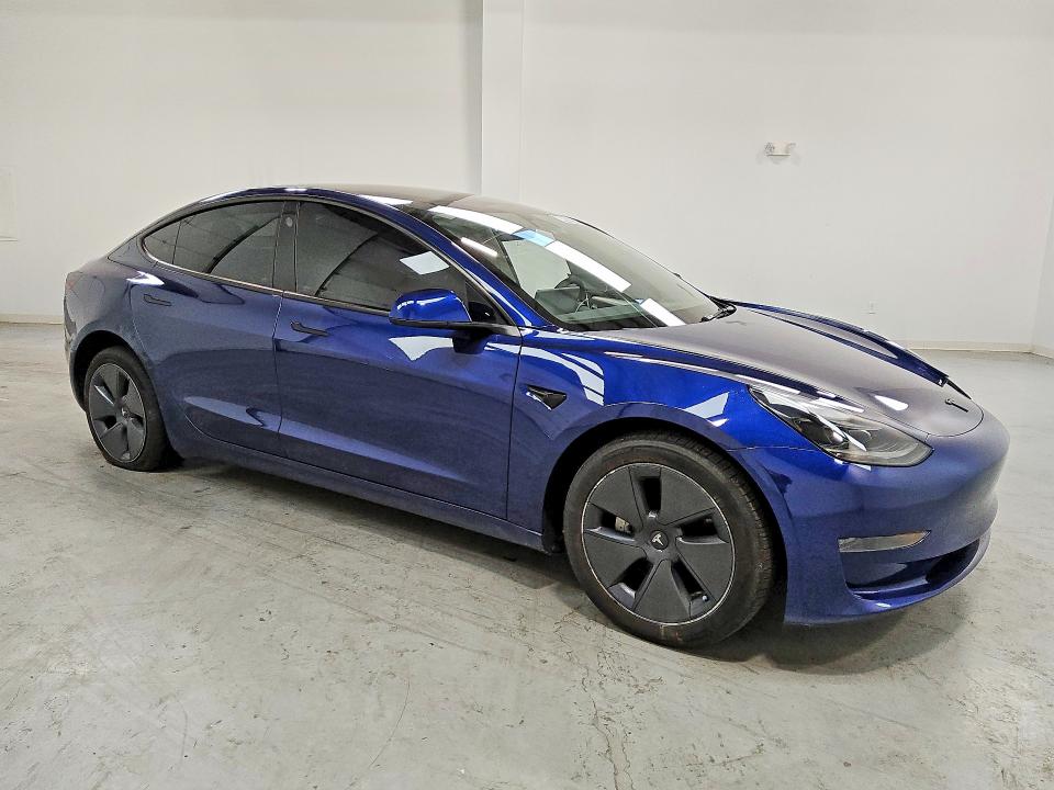 2023 Tesla Model 3 VIN 5YJ3E1EA9PF665190 COPART salvage auction — SIDE, IN - CERTIFICATE OF TITLE, sold $9,000 on 2026-07-23 (photo 4)