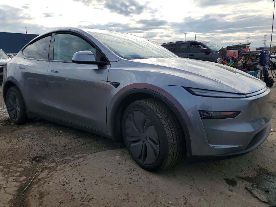 2026 Tesla Model y VIN 7SAYGDEE2TF425111 COPART salvage auction — SIDE, MI - CERT OF TITLE-SALVAGE VEHICLE, sold $19,200 on 2026-07-07 (photo 4)