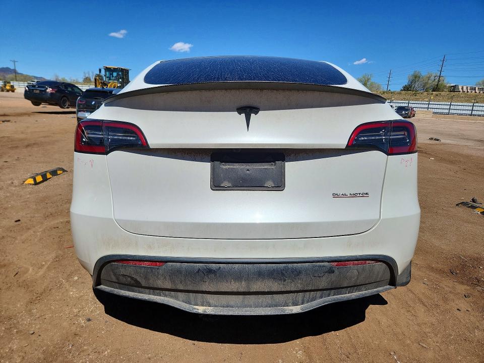 2023 Tesla Model y VIN 7SAYGDEF6PF936786 COPART salvage auction — SIDE, Co - Salvage Title, sold $11,100 on 2026-07-06 (photo 6)