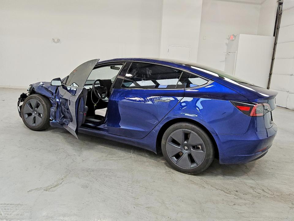 2023 Tesla Model 3 VIN 5YJ3E1EA9PF665190 COPART salvage auction — SIDE, IN - CERTIFICATE OF TITLE, sold $9,000 on 2026-07-23 (photo 2)