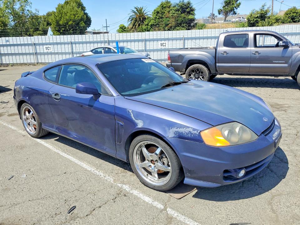 2003 Hyundai Tiburon VIN KMHHN65F03U017880 COPART salvage auction — ENGINE BURN, Ca - Salvage Certificate, sold $200 on 2026-07-10 (photo 4)