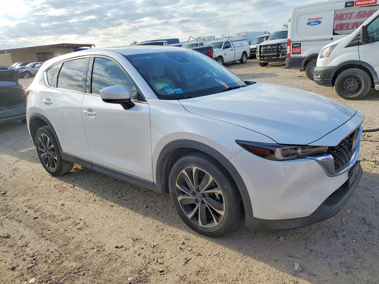2023 Mazda CX-5 VIN JM3KFBEM3P0211144 COPART salvage auction — Minor Dent/Scratches, TX - SALVAGE VEHICLE TITLE, sold $9,800 on 2026-07-02 (photo 4)