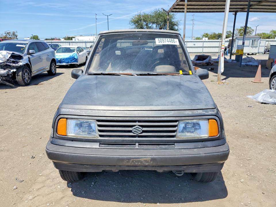 1989 Suzuki Sidekick VIN JS3TA01C5K4112583 COPART salvage auction — MINOR DENT/SCRATCHES, CA - DIS/DLR/EXP ONLY CLEAN TITLE, sold $1,700 on 2026-09-16 (photo 5)