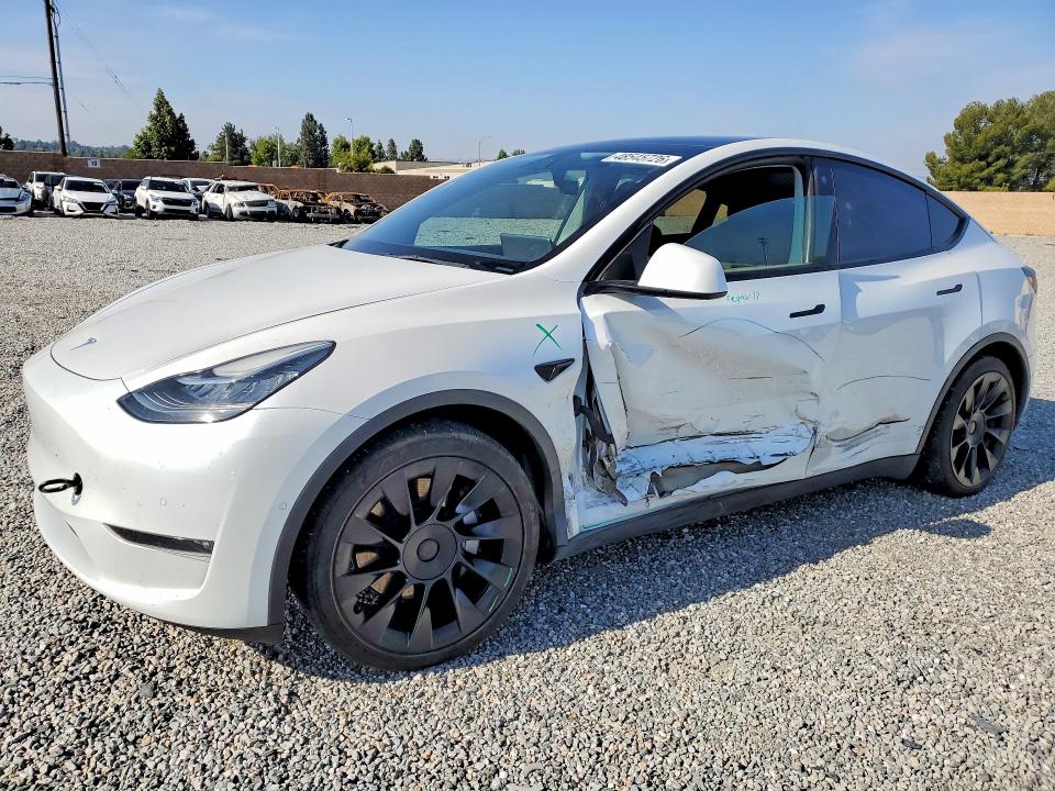 2022 Tesla VIN 7SAYGAEEXNF404184 COPART salvage auction — SIDE, CA, sold $12,300 on 2026-07-15 (photo 1)