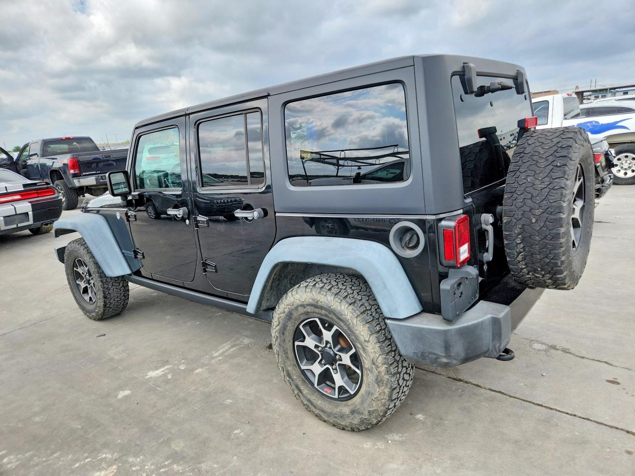 2016 Jeep Wrangler Unlimited VIN 1C4BJWDG7GL103053 COPART salvage auction — Normal Wear, TX - CERT OF TITLE-REBLT SLVG FLOOD (P), sold $7,900 on 2026-07-03 (photo 2)