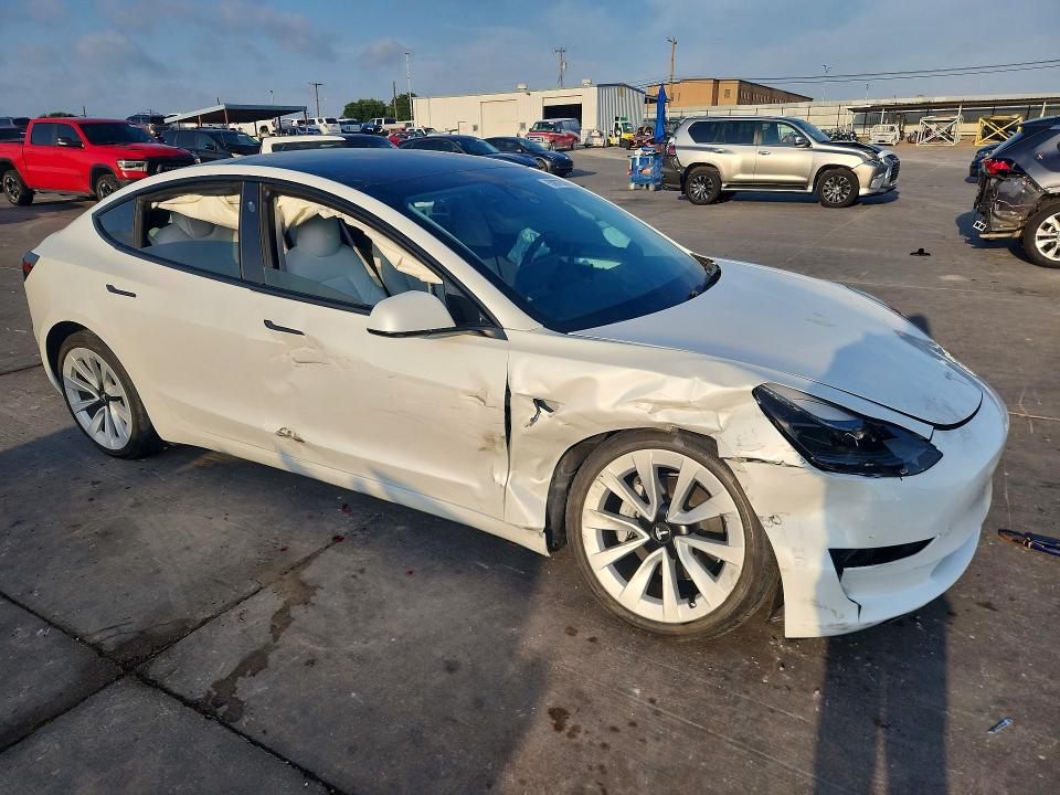 2023 Tesla Model 3 VIN 5YJ3E1EA7PF472150 COPART salvage auction — SIDE, Salvage Title, sold $6,600 on 2026-07-27 (photo 4)