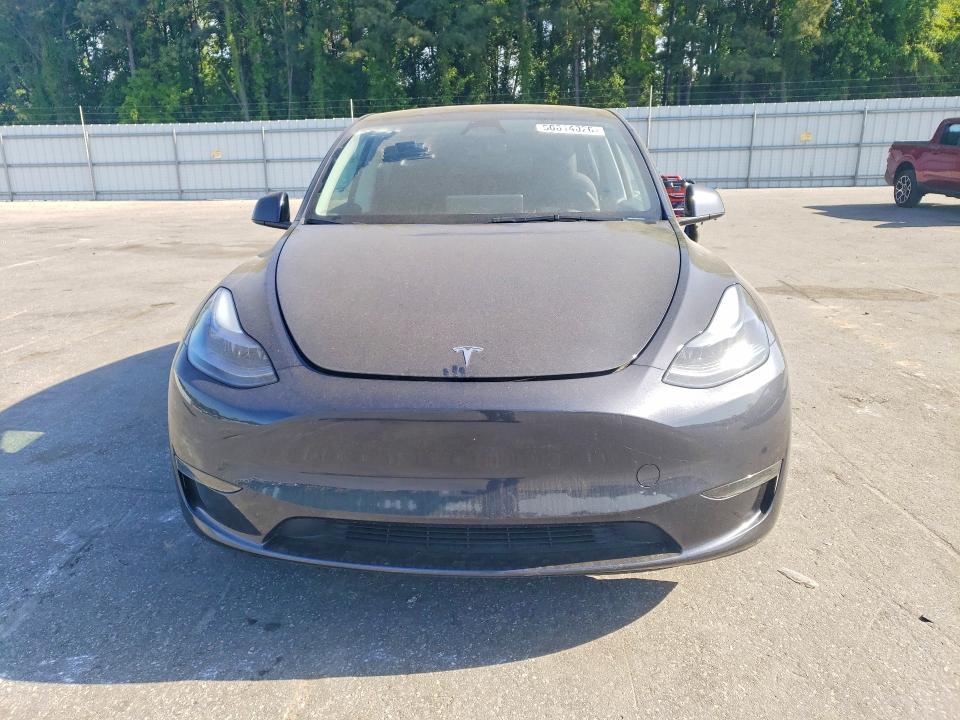 2025 Tesla Model y VIN 7SAYGDED6SA371234 COPART salvage auction — SIDE, Nc - Salvage Certificate Of Title, sold $375 on 2026-07-30 (photo 5)