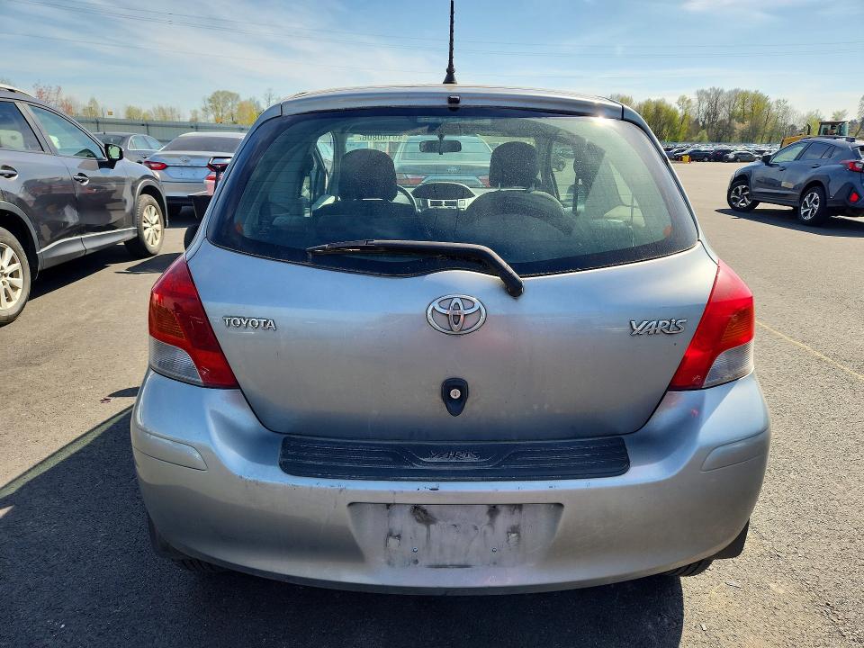 2011 Toyota Yaris VIN JTDJT4K33B5333051 COPART salvage auction — SIDE, Or - Salvage Title Certificate, sold $225 on 2026-07-06 (photo 6)