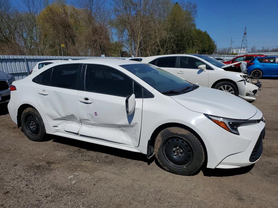2023 Toyota Corolla VIN JTDBDMHE2P3003981 COPART salvage auction — SIDE, Salvage Title, sold $8,300 on 2026-07-21 (photo 4)