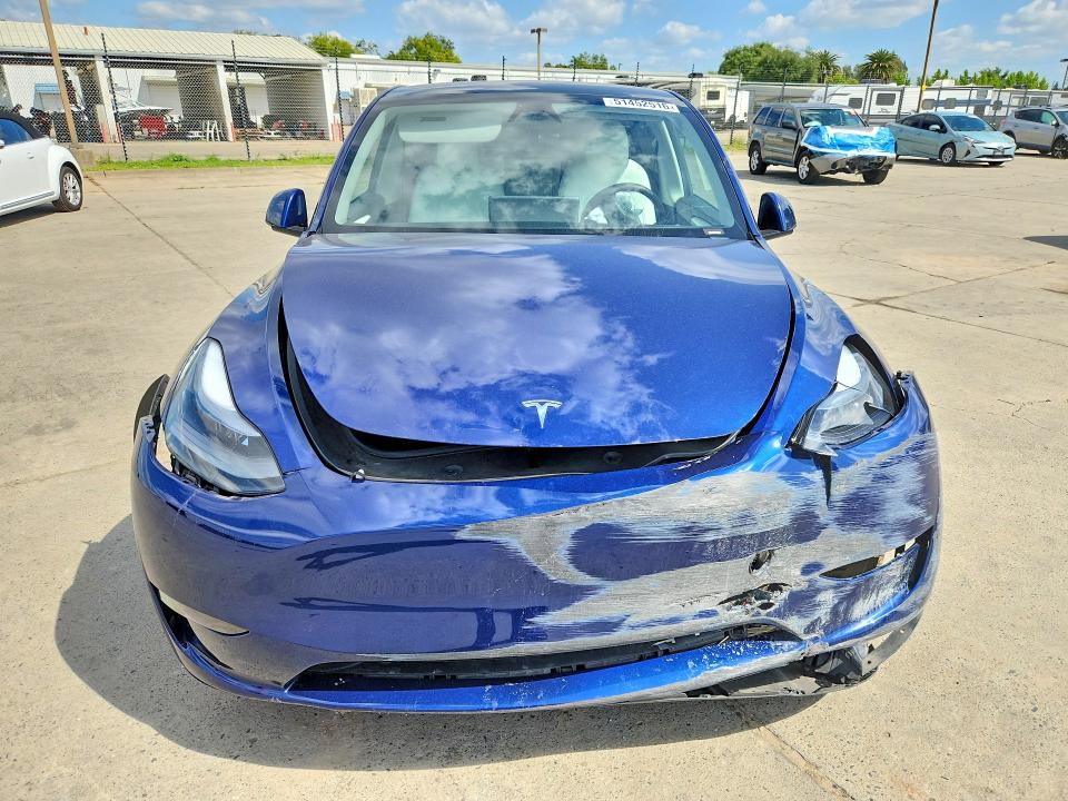 2025 Tesla Model y VIN 7SAYGAEE9SF230779 COPART salvage auction — FRONT END, Salvage Title, sold $12,700 on 2026-07-20 (photo 5)