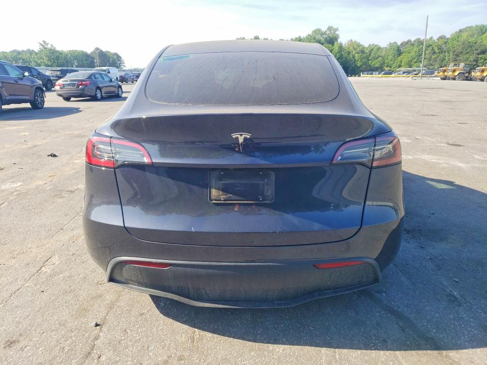 2025 Tesla Model y VIN 7SAYGDED6SA371234 COPART salvage auction — SIDE, Nc - Salvage Certificate Of Title, sold $375 on 2026-07-30 (photo 6)