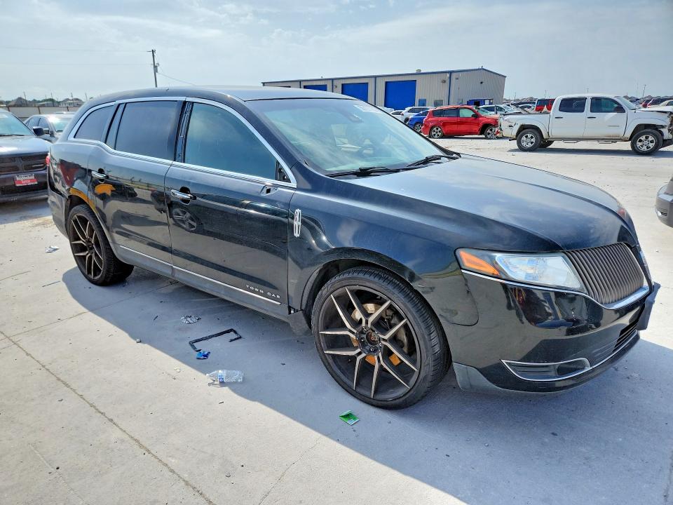 2015 Lincoln Mkt VIN 2LMHJ5NK3FBL00758 COPART salvage auction — SIDE, Tx - Salvage Vehicle Title, sold $450 on 2026-07-03 (photo 4)