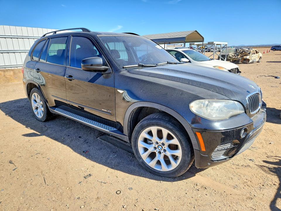 2012 BMW X5 VIN 5UXZV4C52CL987533 COPART salvage auction — MINOR DENT/SCRATCHES, Tx - Dis/Dlr/Exp Only Salvage Title, sold $500 on 2026-07-20 (photo 4)