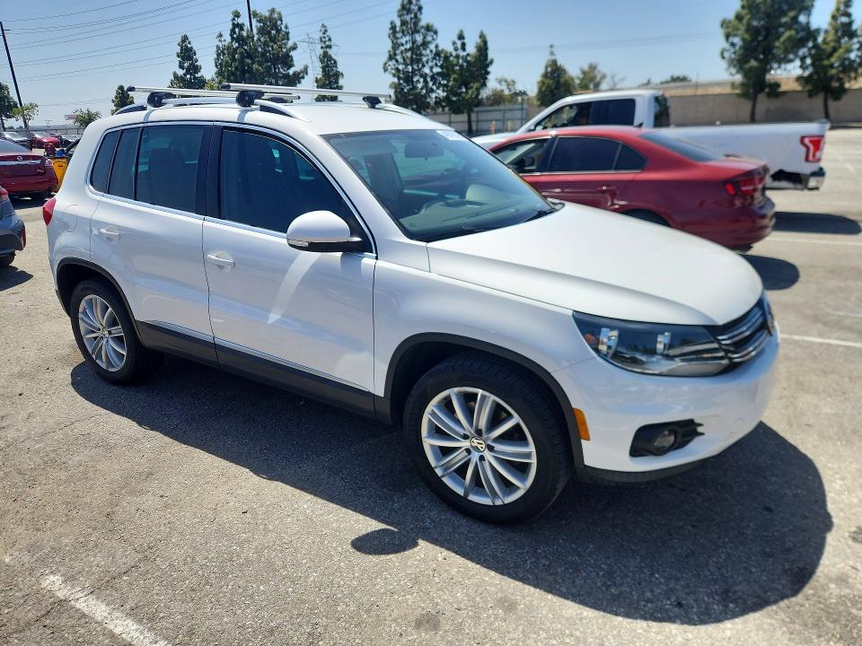 2014 Volkswagen Tiguan VIN WVGAV3AX4EW550496 COPART salvage auction — MECHANICAL, Fl - Derelict Vehicle Certificate (P), sold $4,100 on 2026-07-30 (photo 4)